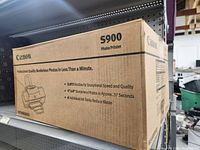 Photo of sealed Canon S900 Photo Printer box showing printer graphic and model information
