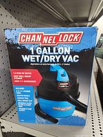 Front view of Channellock 1 Gallon Wet/Dry Vac box showing product image and features including 1.5 peak HP motor, easy wall mount storage, and included accessories.