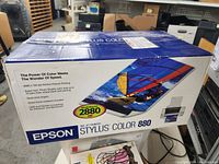 Full view of Epson Stylus Color 880 printer retail box showing detailed colorful graphics and features