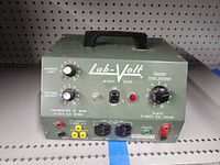 Front view showing Lab-Volt Model 354P controls and connectors, with power switch and indicator light.