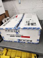 Photo of the original boxed packaging of the Zoom MultiTrak Recording Studio MRS-1266 with built-in CD burner label and branding.