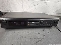 Front view showing the Sony minidisc deck with the digital display reading 'NO DISC', power button, and control buttons.