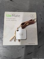 Front of the Tile Mate package showing the product image attached to keys and the branding.