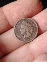 Obverse side of the 1908 Indian Head penny showing Lady Liberty profile in Native American headdress and date '1908'.