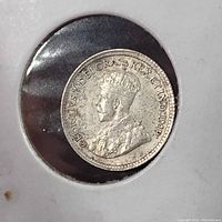 Obverse view of the 1917 Canada 5 cent silver coin showing King George V with inscription.