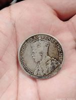 Obverse side of the 1917 Canadian silver 50 cent coin showing King George V with inscription.