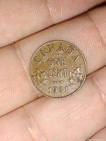 Close-up of reverse side showing 'CANADA ONE CENT 1931' with maple leaves