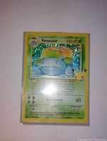 Front view of Venusaur holographic Pokemon card showing full card details and holographic shine