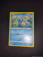 Front image of Squirtle Pokemon Go trading card showing artwork and details.