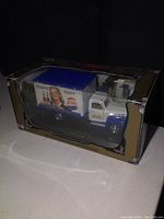 Front side view of the boxed Pepsi Cola die cast truck showing vintage ad graphics and box condition