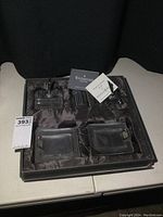 Three-piece crystal desk set in original box containing Waterford pen holder and two Mikasa square trays.