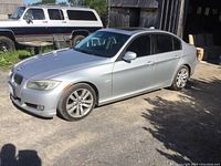 Side profile showing silver body, alloy wheels, sunroof