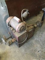 Top and side view of the aged Van Norman brake lathe showing GE electric motor and hand crank controls.