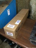 Sealed brown cardboard box with AutoShack label and MaxSold lot sticker for Dodge Ram CV axle shaft