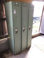 Front view of the 3-door steel locker cabinet showing the doors, handles, and ventilation slots.