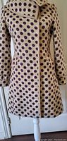Front view of the ladies large polka dot coat on a mannequin, showing overall design and fit.
