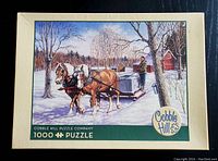Box front showing puzzle image with horses pulling sled and man collecting sap. Marked 1000 piece, Cobble Hill Puzzle Company.