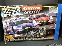 Original box of Carrera GO!!! DTM Master Class slot racing set featuring 1:43 scale racecars and track info