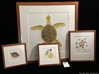 Four framed etchings by Matthew Smith arranged grouped showing marine-themed artwork including a large sea turtle, smaller shell designs, and a turtle with starfish