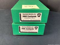 Two green Overland Models Inc. boxes stacked, labels read PRR Centipede w/antennas (Type II) and w/o antennas (Type II)