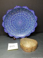 Photo showing both Persian mosaic wood trinket box and hand painted metal bowl on display.