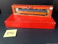 Two Rivarossi Union Pacific HO scale model trains in original red packaging, one stacked on top of the other on a black surface with price tag $49.95 visible.