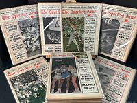 Photo showing a selection of The Sporting News magazines from 1967 with various cover stories predominantly about football and baseball.