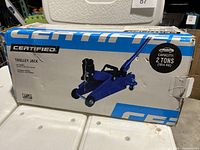 Box of Certified 2 Ton Capacity Trolley Jack with branding and capacity details on side