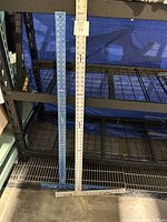 Two heavy duty drywall T-squares standing upright, showing approximate lengths of 48 and 54 inches.