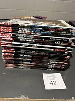 Stack of Marvel Punisher comic books showing spines with titles and publisher logos