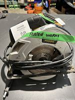 Mastercraft circular saw top and side view showing blade, power cord, and handle.