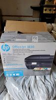 Front view of the HP OfficeJet 3830 printer box with product image and branding.