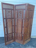 Full front view of the three-panel room divider against a white backdrop