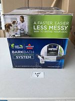 Box showing the Bissell BarkBath system and its use for dog bathing.