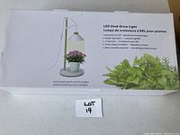 Box of LED Desk Grow Light showing product image and features including automatic on/off, height adjustable, 21 LED chips, cETLUS adapter included, minimal assembly required