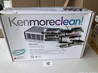 Box of Kenmore electronic air cleaner showing product name and partial product image.