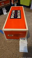 Top of original orange Lionel Electric Trains box with logo