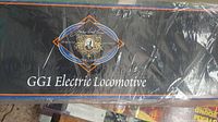 Front of original box showing GG1 Electric Locomotive logo and Joshua Lionel Cowen Series artwork