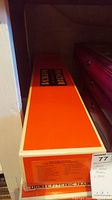Original orange and white Lionel Electric Trains box top showing branding