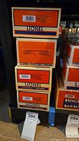 Stack of Lionel Electric Trains boxes showing lot contents.