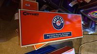 Top of Lionel Odyssey style box lid with logo and lot name