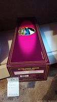 Burgundy box with gold trim and Susquehanna logo showing the item identification and lot number.