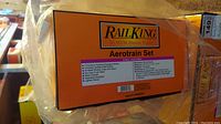 Front of orange and black RailKing Aerotrain box showing branding and model name