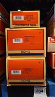 Three Lionel boxes stacked showing model numbers 6-16090, 6-18139, 6-18138