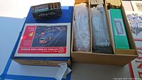 Lot overview with boxes, trolley book, and packaged trolley cars