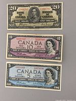 Front sides of $20 (1937), $10 (1954), and $5 (1954) Canadian bills showing key portraits and denominations.