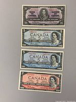Front view of four Canadian banknotes including the 1937 $10, two 1954 $5, and one 1954 $2 bills showing portraits, colors, and serial numbers
