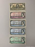 Front view of 1937 $20 bill and 1954 $10 bill showing design and condition