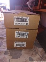 Three stacked unopened cardboard boxes with NAPA part labels 6-011-A and 6-010-A.