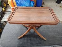 Front angle of the Duncan Phyfe style side table showing the tray top and legs.